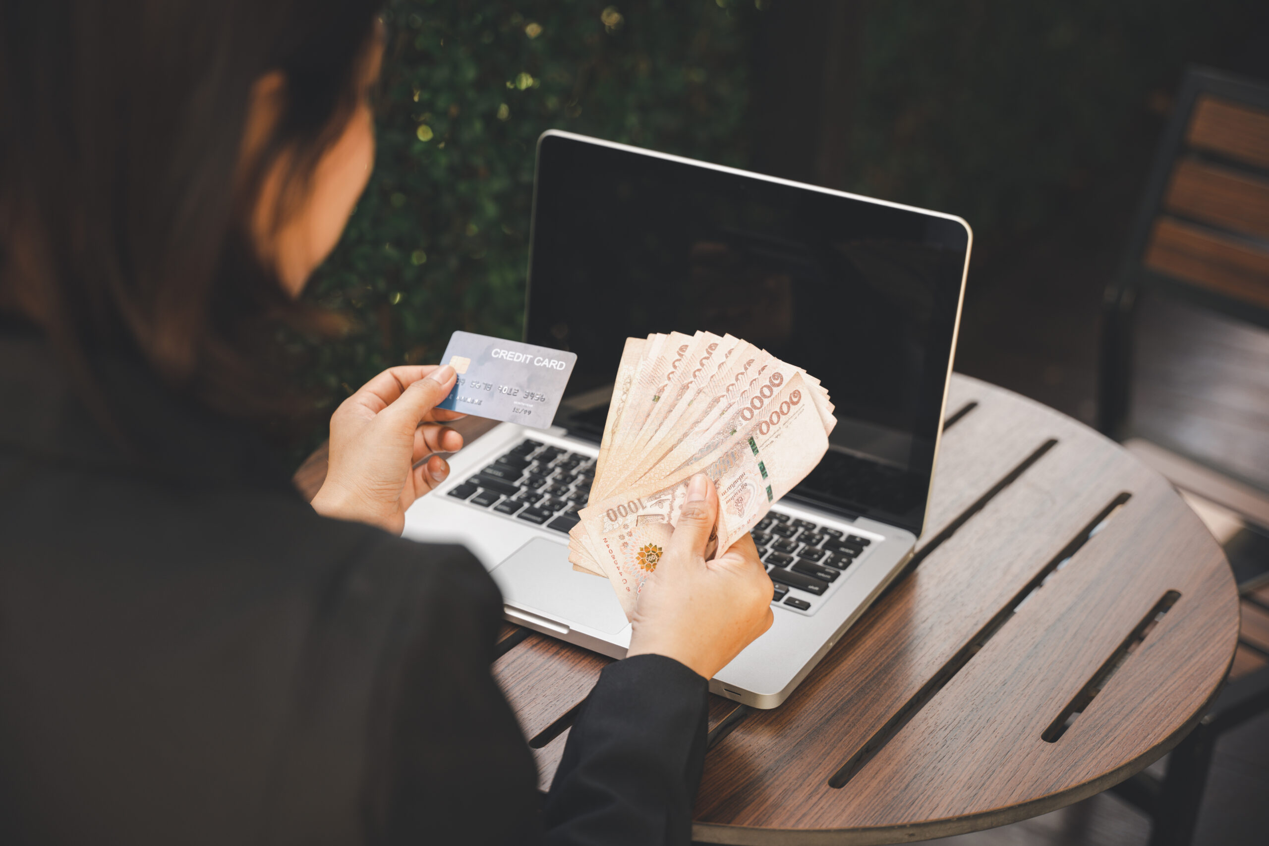 Woman using working and shopping outdoor at cafe coffee shop